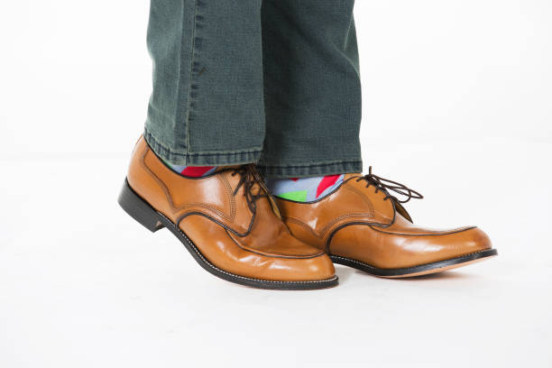 istock Brown leather lace up shoes and jeans 686702476