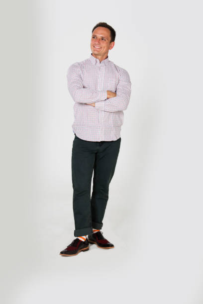 istock Stylish man poses in studio wearing smart casual clothes 686702664
