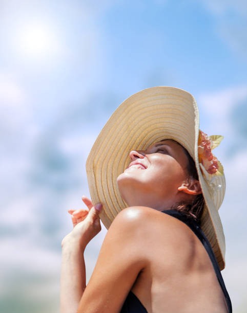 istock Woman in big straw hat in sun shine 686708664
