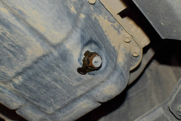 istock Drain the old oil from the engine through the drain plug 686712536