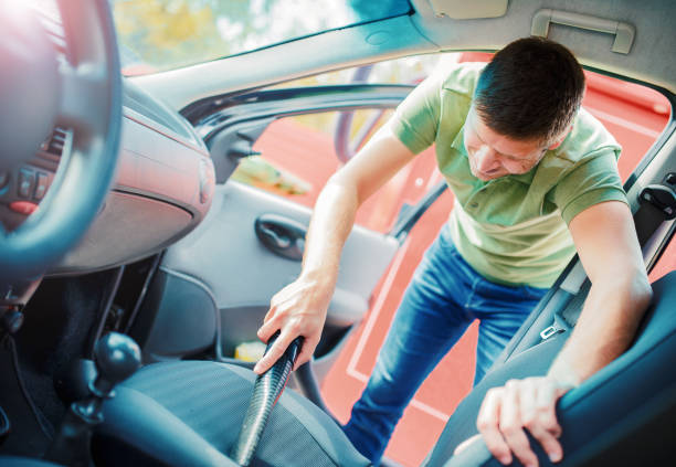 istock Man cleaning the interior of his car 686718046