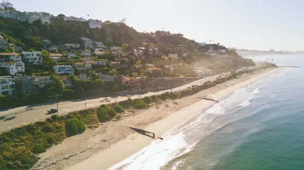 An aerial shot of beach front homes in Malibu, CA.