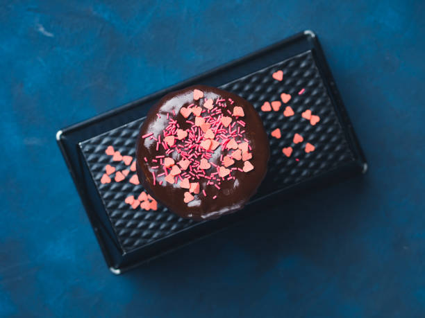 istock Cream cheese cake with chocolate glaze, sprinkles 686724804