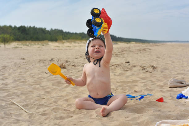 istock Child playing on sand near Sea. 686730578