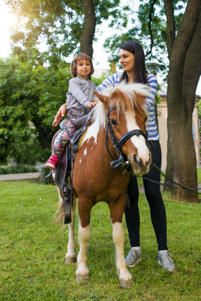 istock Excited Young Girl Taking a Pony Ride 686730786