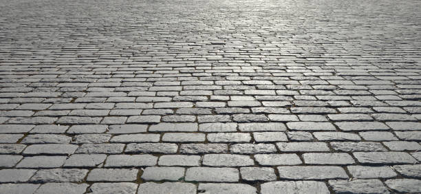 abstract background of old cobblestone pavement - paving stone cobblestone road old imagens e fotografias de stock