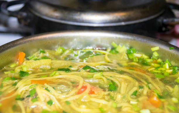 istock Cauldron of yellow chicken soup 686744274