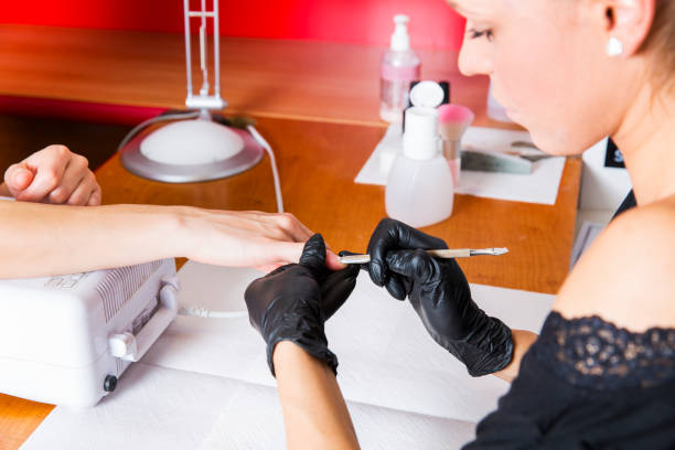 istock Manicure treatment...beautiful woman doing nail art 686744398