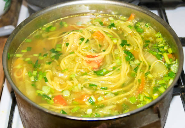 istock Cauldron of yellow chicken soup 686746860