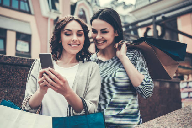 istock Girls doing shopping 686753594