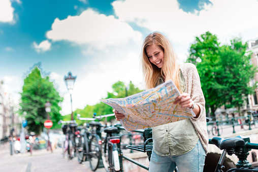 tourist with map in amsterdam