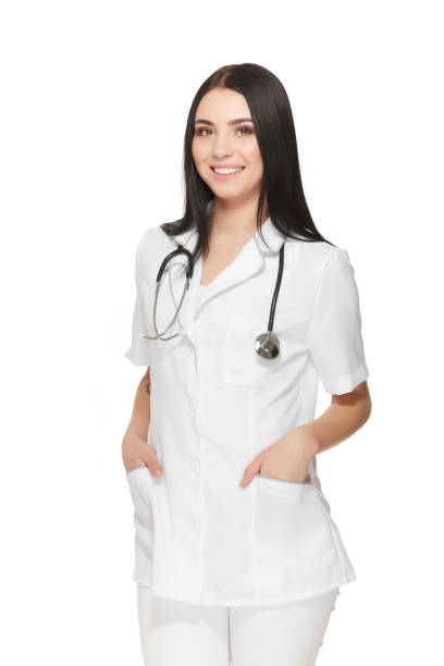 istock Beautiful nurse with stethoscope around neck holding hands in pockets 686777316