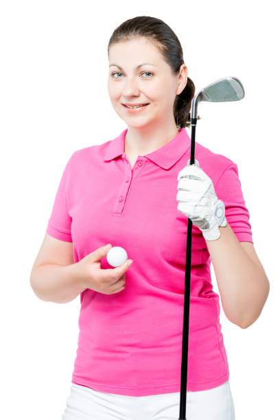 menina sorridente, posando com um taco de golfe no estúdio - golf women pink ball - fotografias e filmes do acervo
