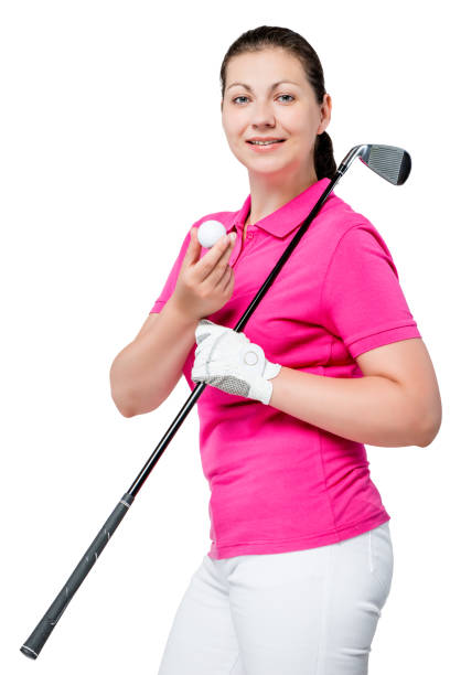 молодой профессиональный игрок в гольф позирует на белом фоне - golf women pink ball стоковые фото и изображения