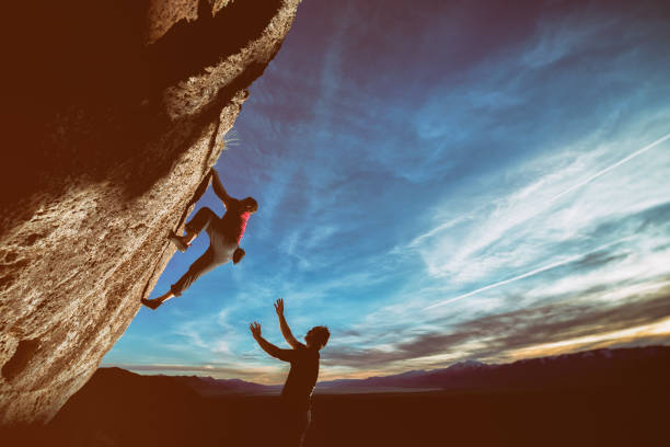 istock Friend and trainer spotting climber 686806500
