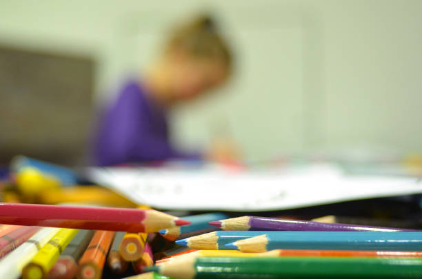 Creative atmosphere with vibrantly colored pencils and papers