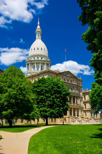 istock Michigan State Capitol Building with Trees and Deep Blue Sky 686809166