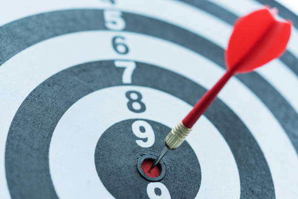 istock Dart target arrow hitting on bullseye with sun light 686823472