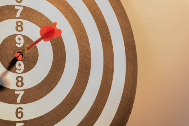 istock Dart target arrow hitting on bullseye with sun light 686823780