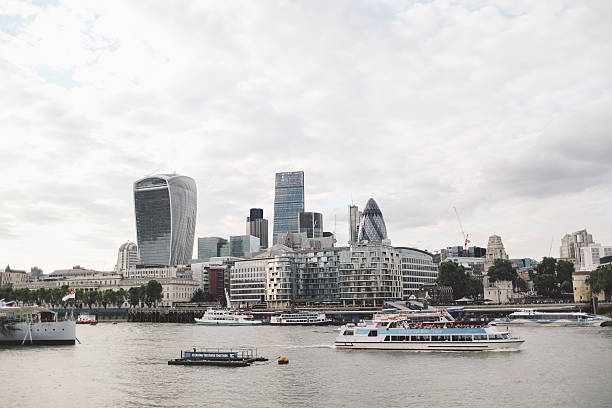 istock 30 St Mary Axe By Thames River Against Sky In City 686825871