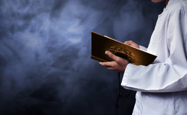 istock Asian muslim kid reading koran 686828082