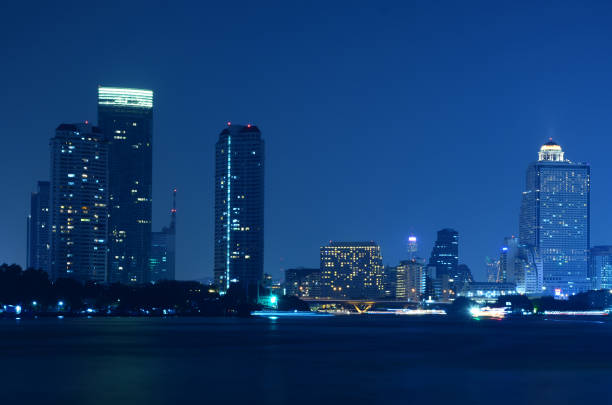 istock bangkok city skyline from the Chao Phraya River by night Light passing 686828588