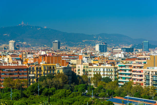 istock Barcelona Skyline with Mountains and Trees 686837498