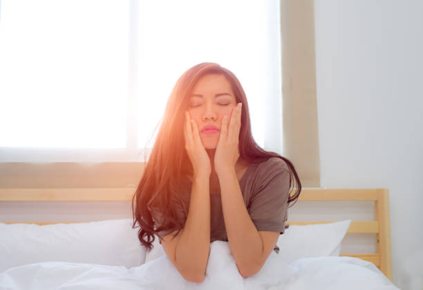 istock Young woman waking up in her bed 686837686