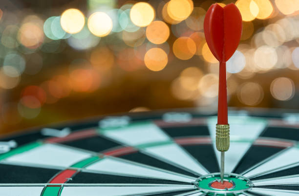 istock Dart target arrow on bullseye over bokeh background 686837854