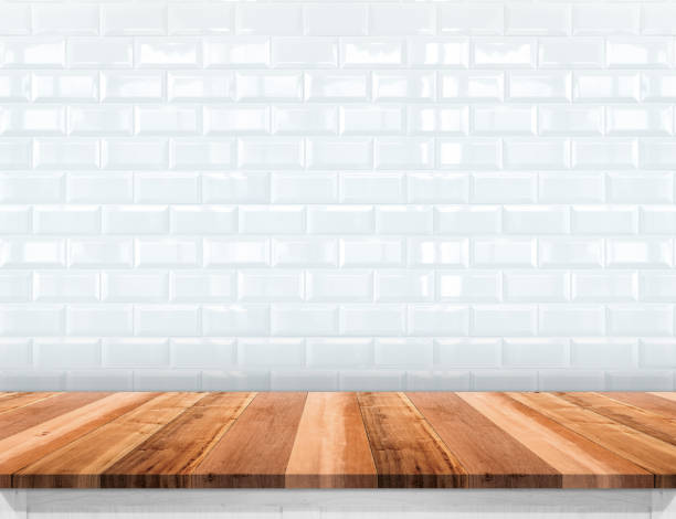 istock Empty wood plank table top with glossy ceramic white tile wall,Mock up for display or montage of product 686840484