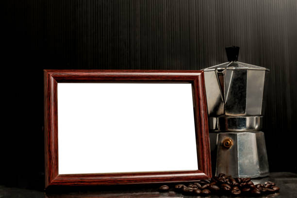 Hot coffee roasted with moka pot and blank photo frame.Roasted coffee beans.