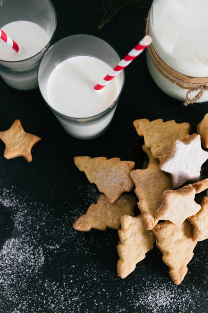 istock Christmas traditional cookies with milk on the table 686855962