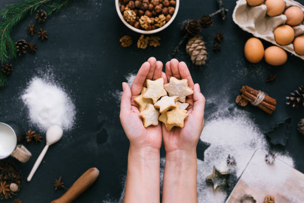 istock Hands holding star shaped cookies, top view 686856018