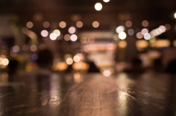 istock Wood table with blur light in night cafe,restaurant background 686856678