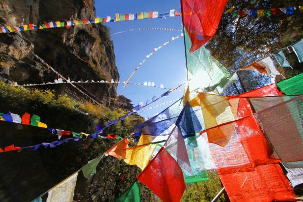 Colorful Buddhist prayer flags at Taktshang Goemba or Tiger's nest monastery in Paro, Bhutan stock photo