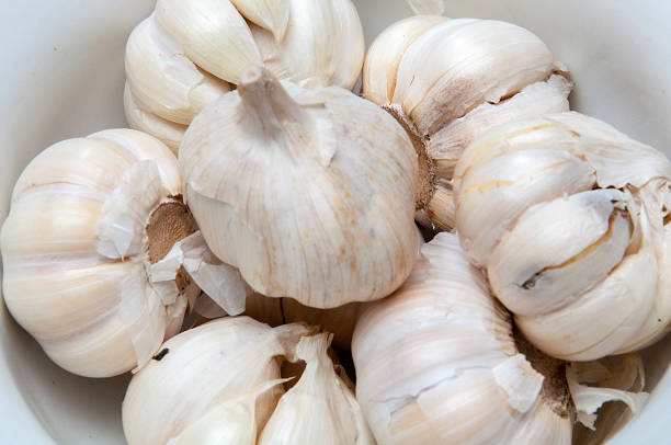 istock Bowl of raw garlic. 686872736
