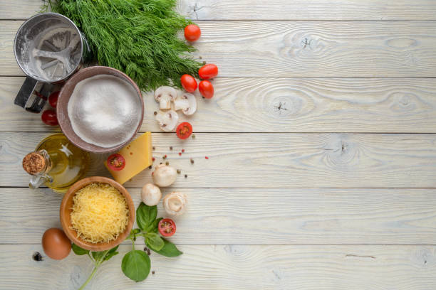 ingredients for pizza on a wooden background top view stock photo