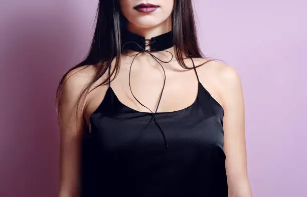 Fashion portrait woman with black velvet choker lace up. Necklace gothic accessory