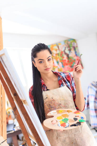 istock Young woman drawing in art studio 686883002