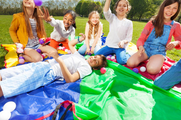 istock Group of happy kids having fun playing with balls 686887360
