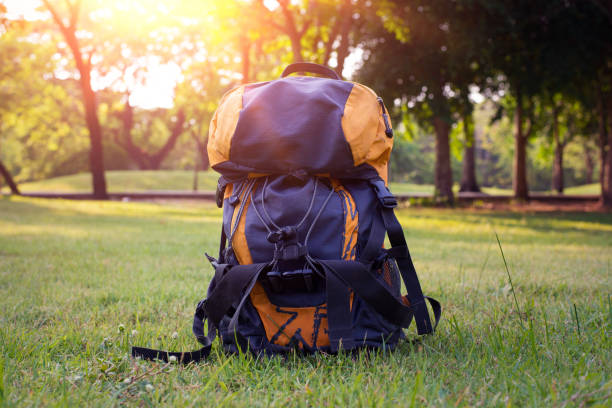 istock Thermos and backpack outdoors on autumn nature. 686889888