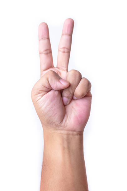 istock Man's hand making victory sign, isolated on a white background 686892938