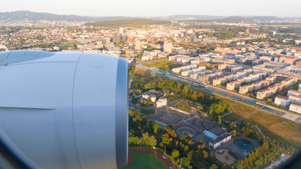 istock Cityscape looking from the airplane windows view, thru the jet engine. 686893344