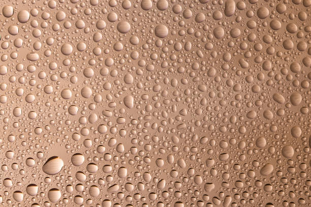 istock Closeup of water drops on glass surface 686895860