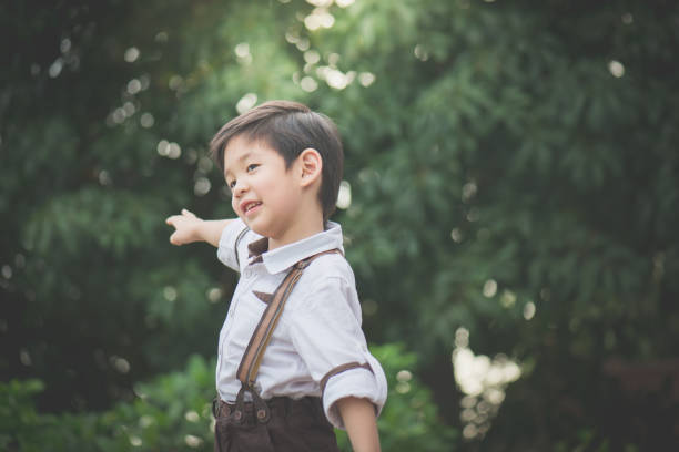 istock Asian child playing pilot aviator in the park 686898994