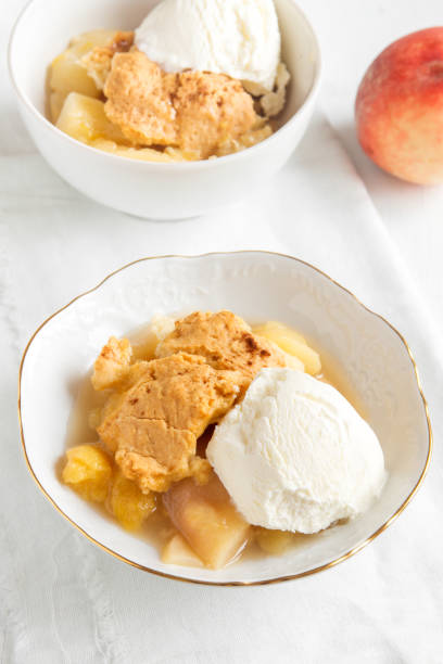 istock peach cobbler with vanilla ice cream 686911448