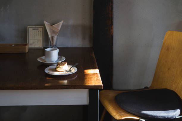 Small paper crane origami in a cafe by window