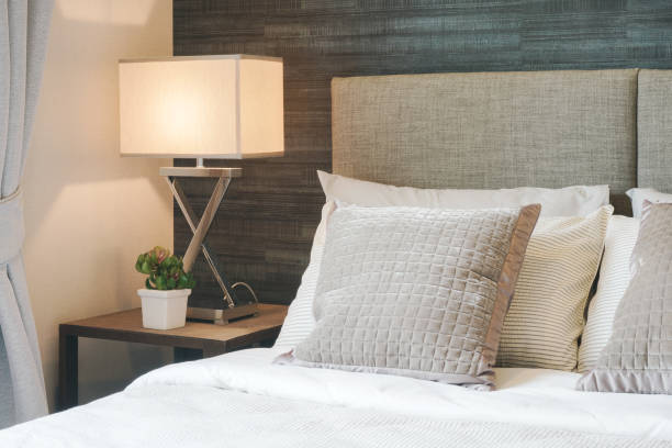 istock Hotel style bedding with white shade reading lamp 686911608