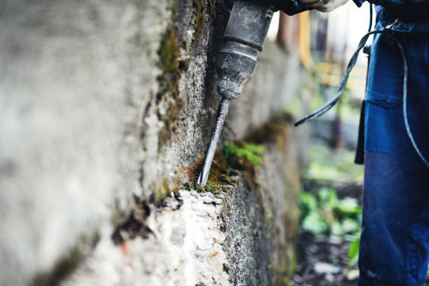 istock Working man practicing his skills with pneumatic drill at demolishing walls 686912184