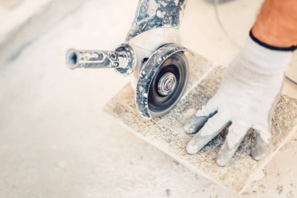 industrial tool, hand grinder cutting granite stone used for paving